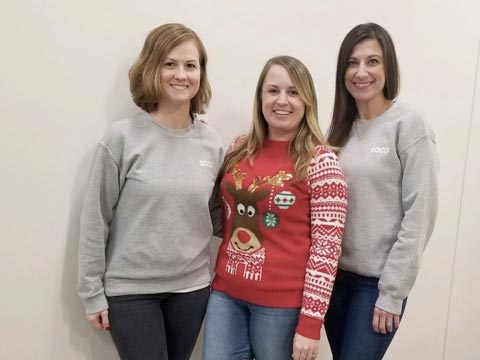 Employees wearing Christmas shirt