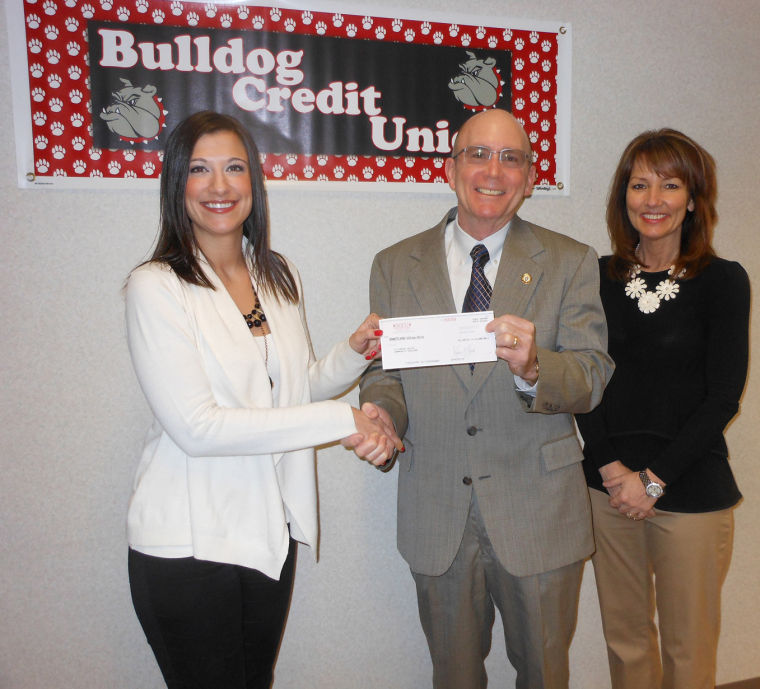 Joining IVCC President Jerry Corcoran are Bulldog Credit Union Branch Manager Ryan Neumann and Streator Onized Credit Union Chief Executive Officer Kathy Lucas.