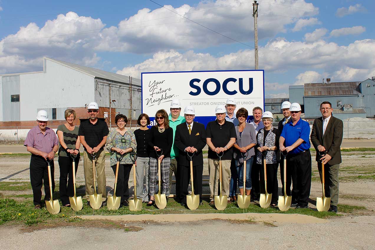 Board members, senior staff and management break ground.